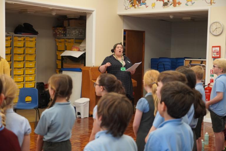 A group of children from Elston School singing together