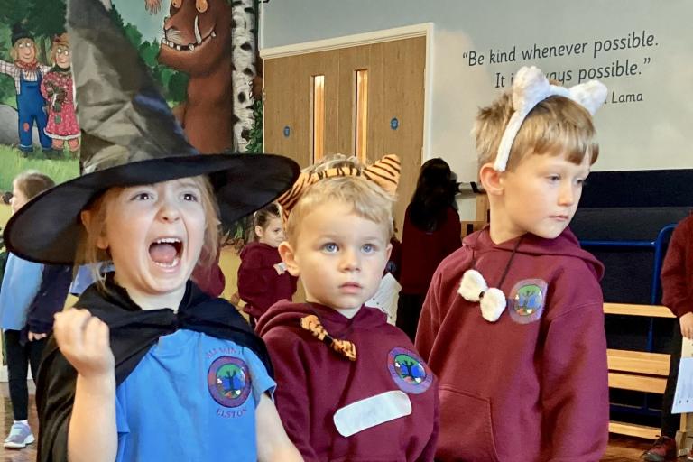 Three young school children in costume
